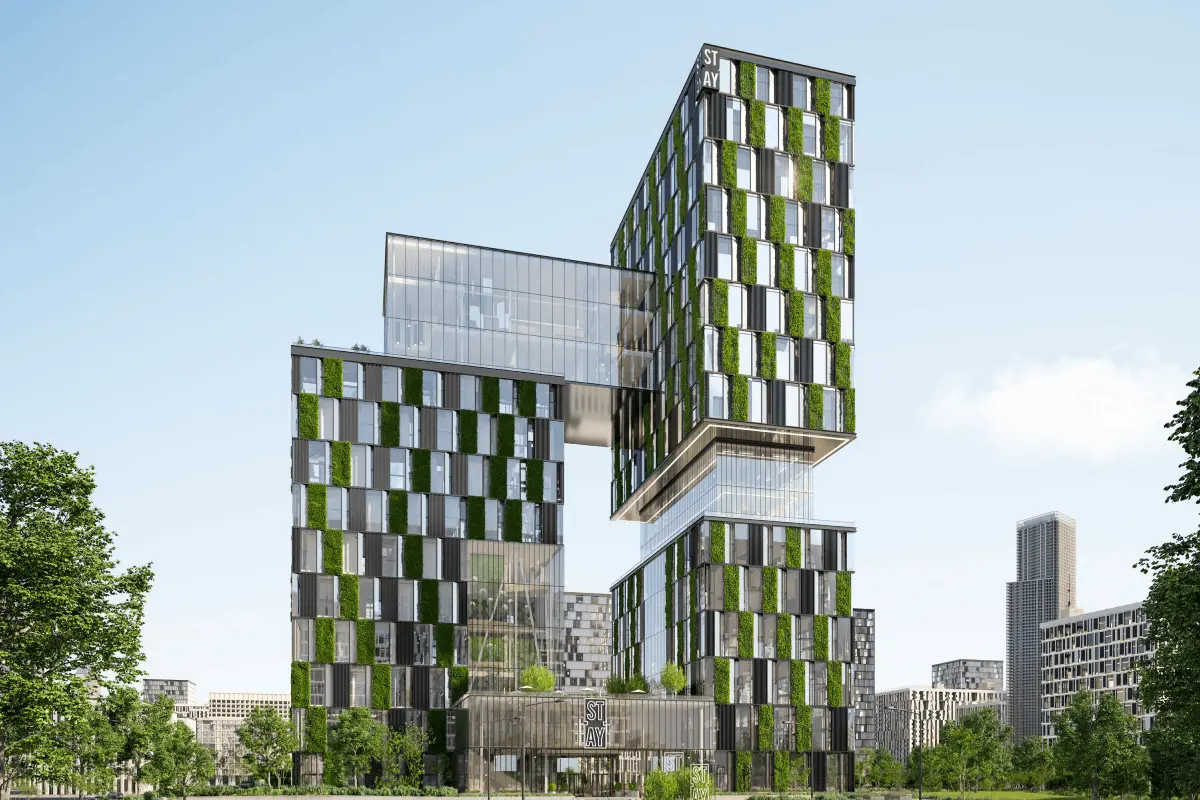 Moderne, mehrstöckige Bürogebäude mit begrünten Fassaden und Glasfronten.